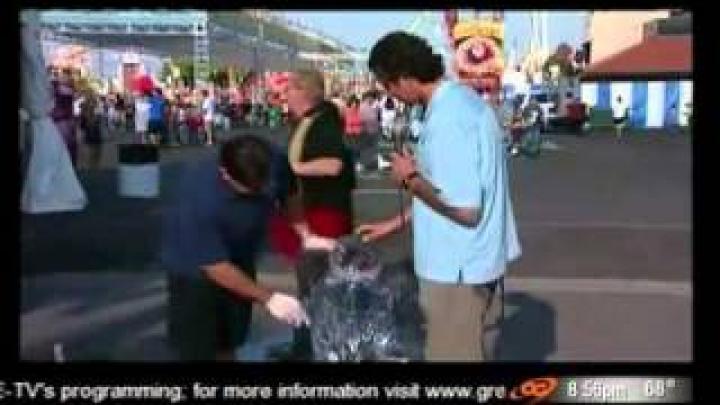 TV reporter knocks over ice sculpture